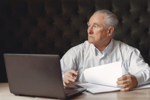 a mesothelioma victim checking documents needed to submit claims after asbestos exposure