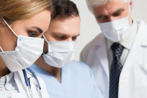 a team of medical specialist treating a mesothelioma patient