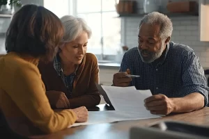 a male mesothelioma patient signing a document for financial aid