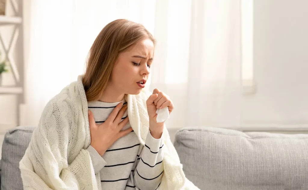 woman exposed to fine dust experiencing persistent cough